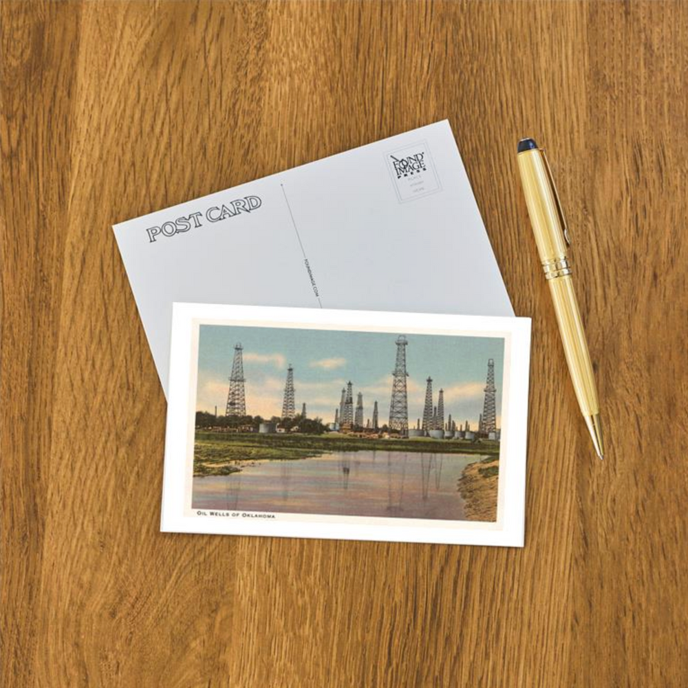 Retro postcard featuring oil wells and river scenery, inspired by Oklahoma’s early oil boom.