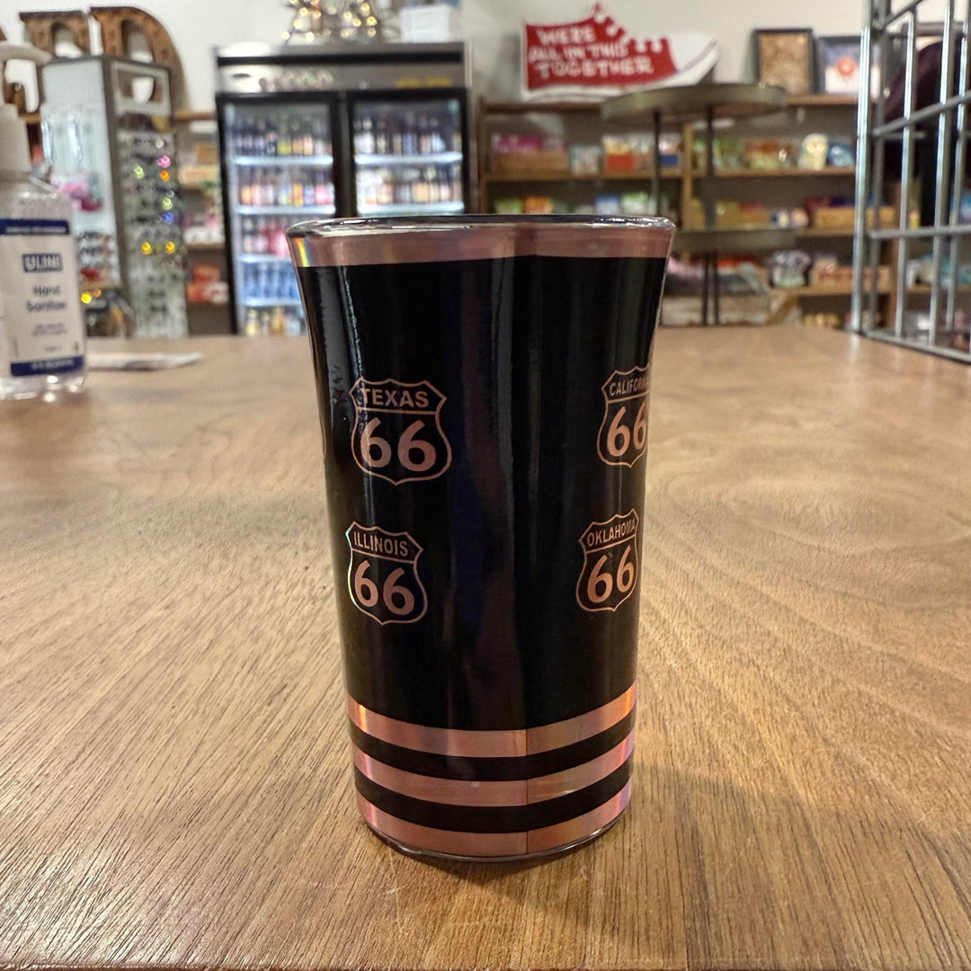Route 66 whiskey glass with metallic accents and highway design