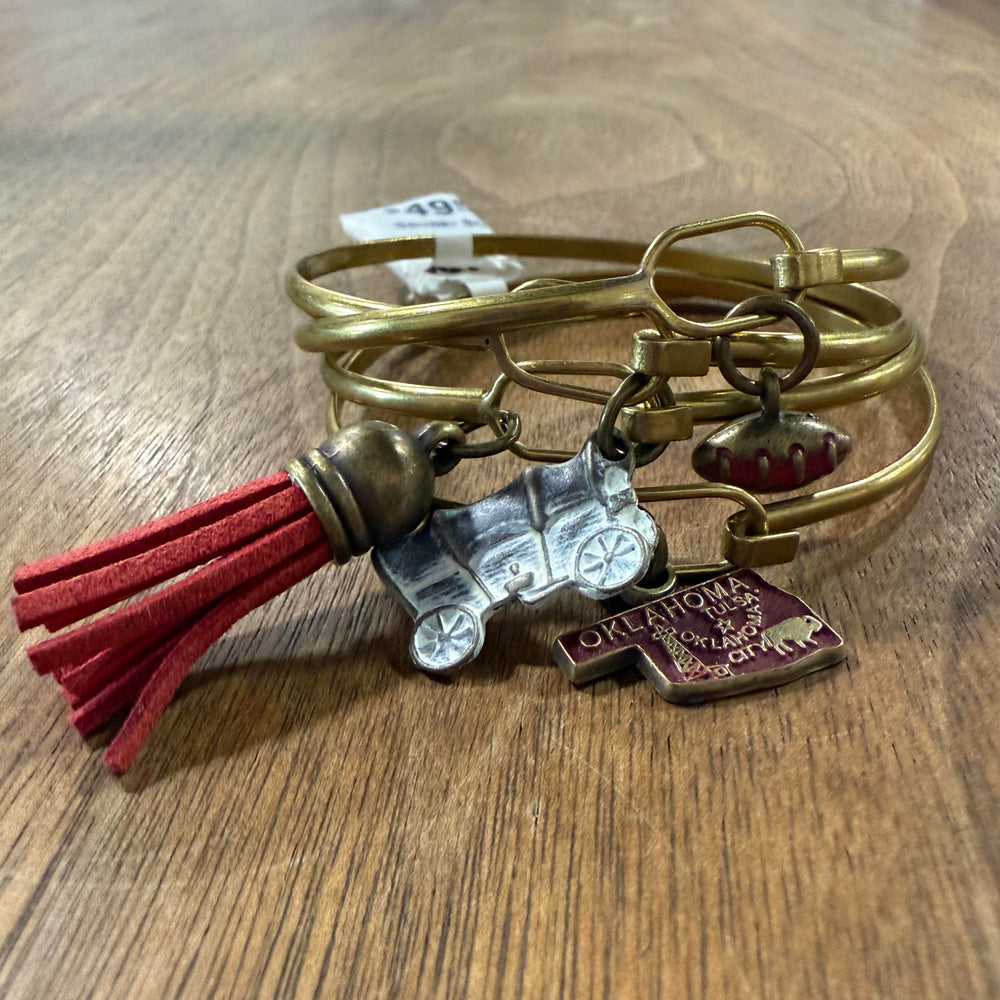 Game day bangle set for OU fans with red charms, covered wagon, and football details – gold-tone finish