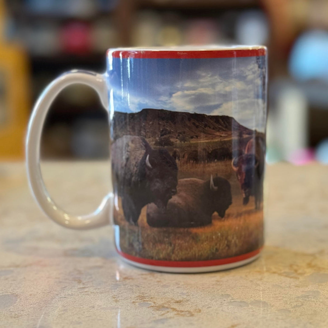 Back side of ceramic Oklahoma mug featuring buffalo across the wraparound design