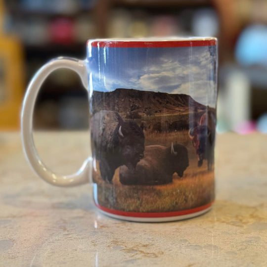 Back side of ceramic Oklahoma mug featuring buffalo across the wraparound design