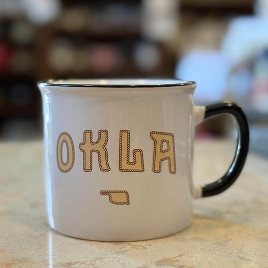 Oklahoma souvenir mug with state outline and rope design