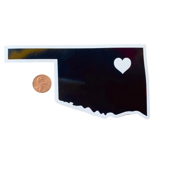 Black Oklahoma state vinyl sticker with white outline and heart marking Tulsa