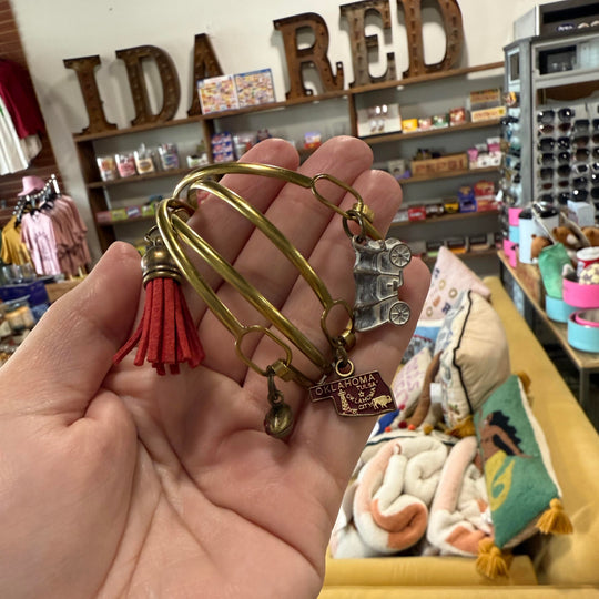 Gold-tone bracelet stack with OU-inspired charms – perfect Oklahoma Sooners fan gift or souvenir
