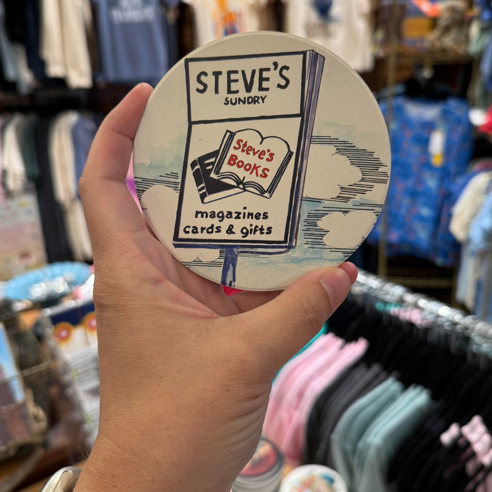 Tulsa souvenir coaster with retro-style artwork of Steve’s Sundry, a local bookstore and lunch counter