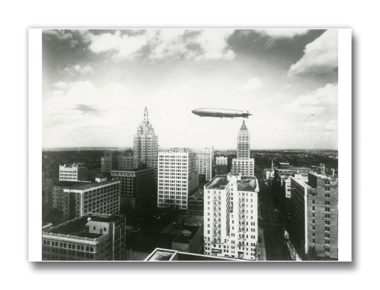Matte finish magnet featuring a historic 1929 dirigible flying over Downtown Tulsa.