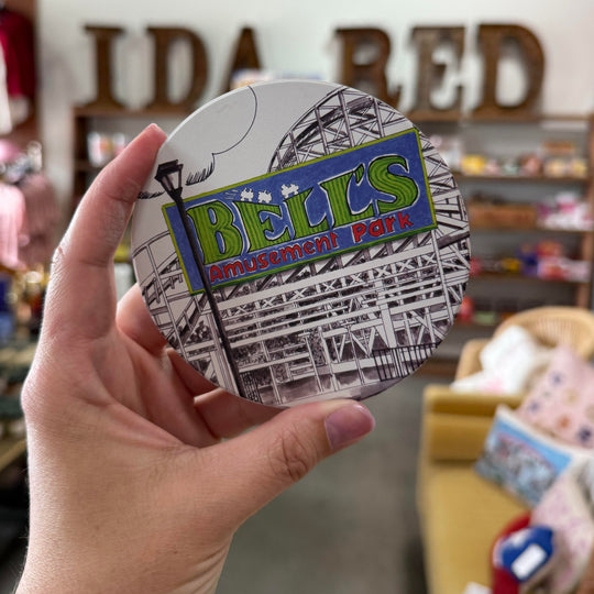 Detailed illustration of Bell’s Amusement Park on a ceramic coaster from the Tulsa in Ink collection