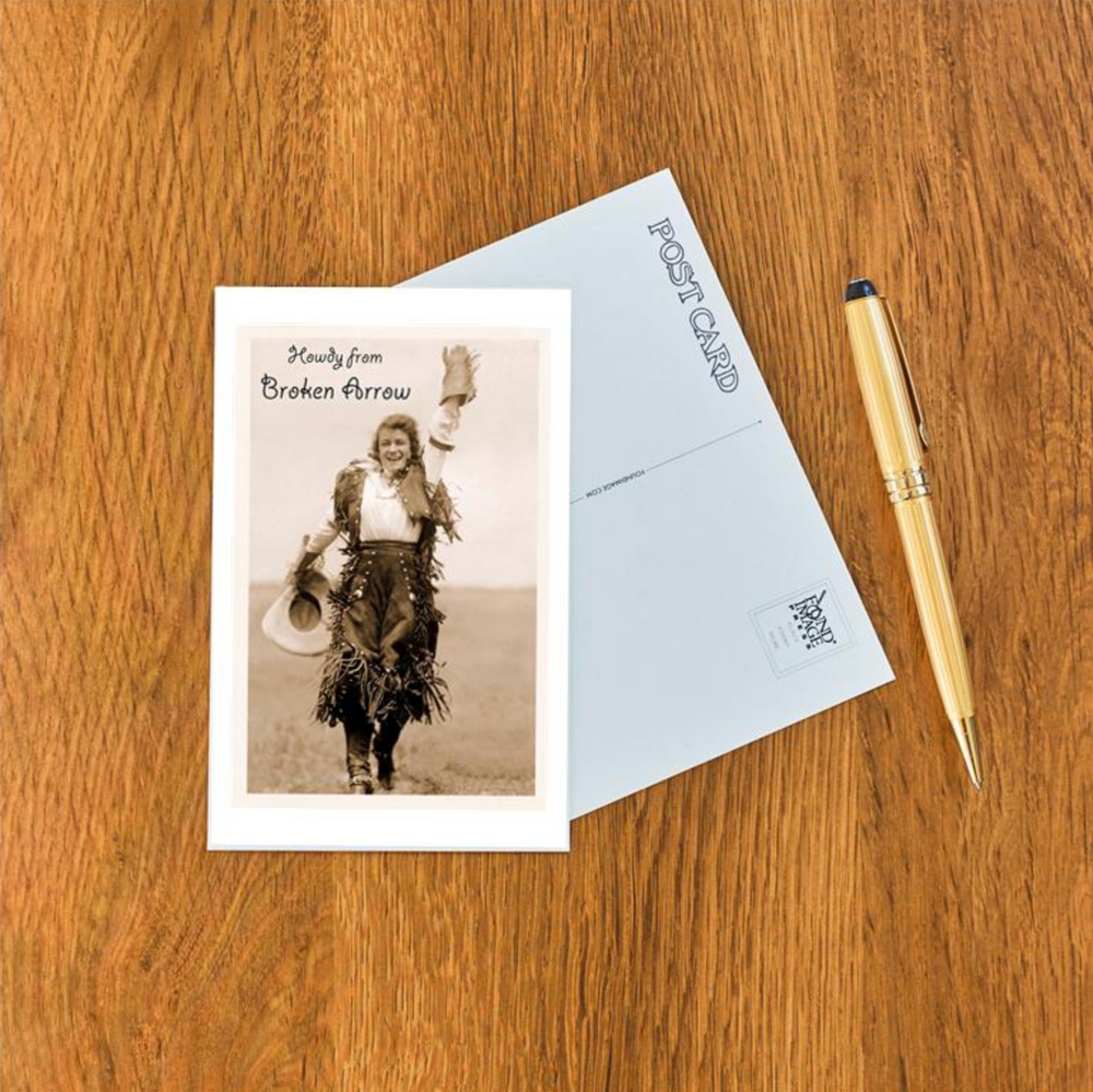 Nostalgic postcard with a vintage cowgirl waving and “Howdy from Broken Arrow” lettering.