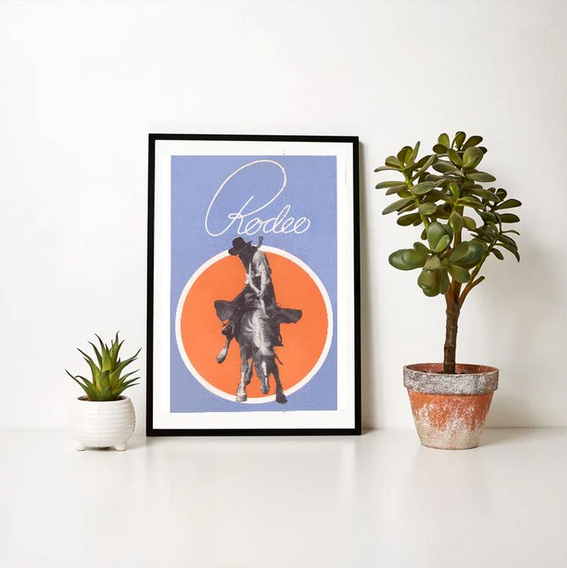 Vintage rodeo print featuring cowboy on a bronco with bold orange and blue design.