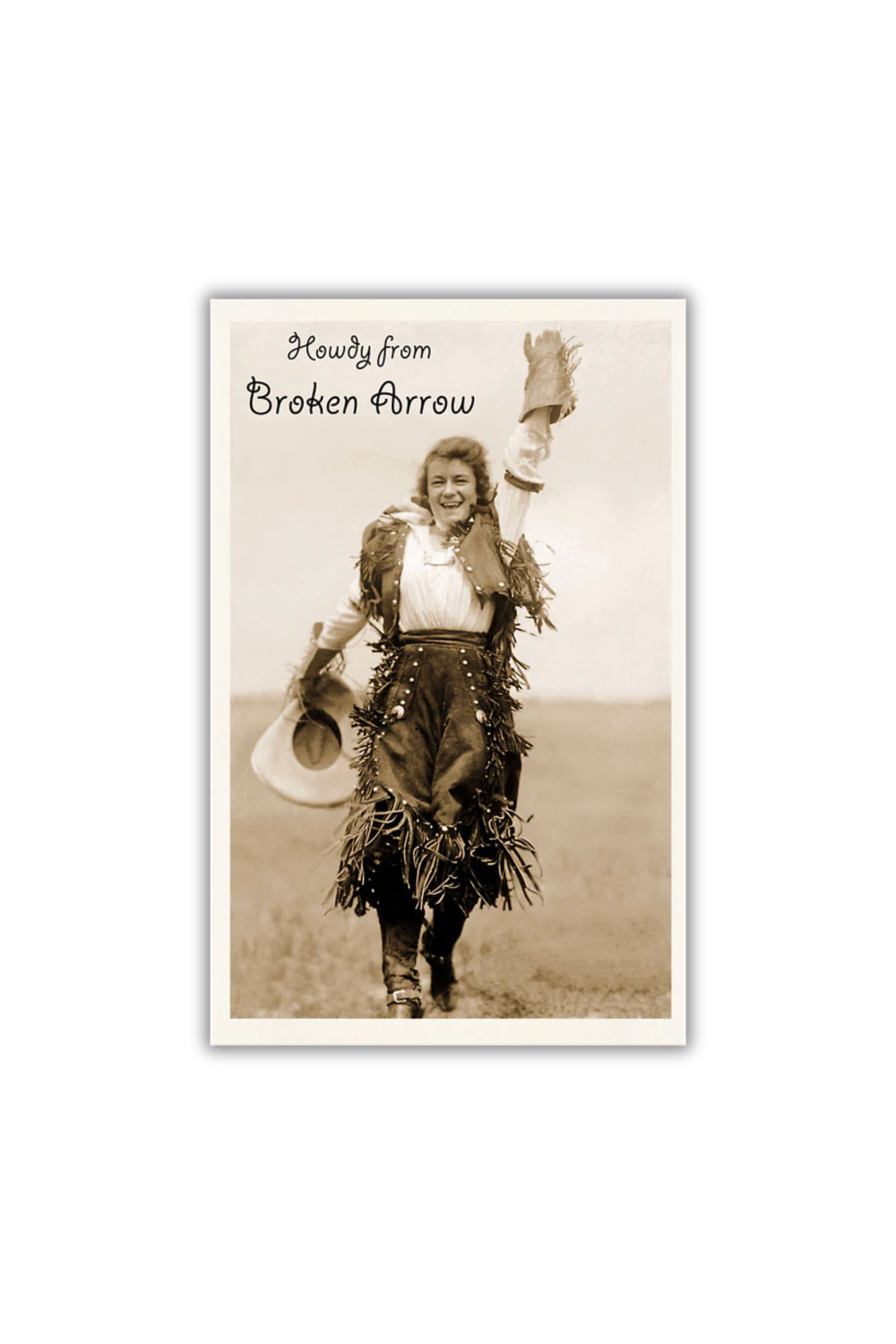 Vintage postcard showing a smiling cowgirl waving with text that reads “Howdy from Broken Arrow.”