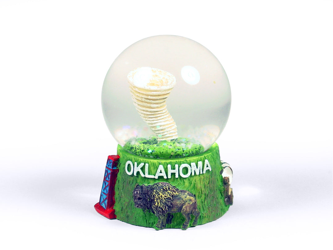Oklahoma snow globe with miniature tornado and state landmarks