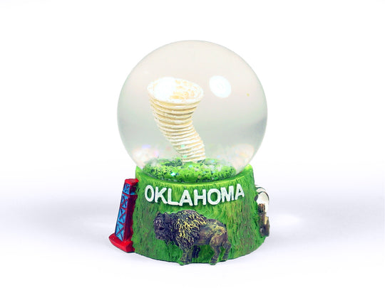 Oklahoma snow globe with miniature tornado and state landmarks