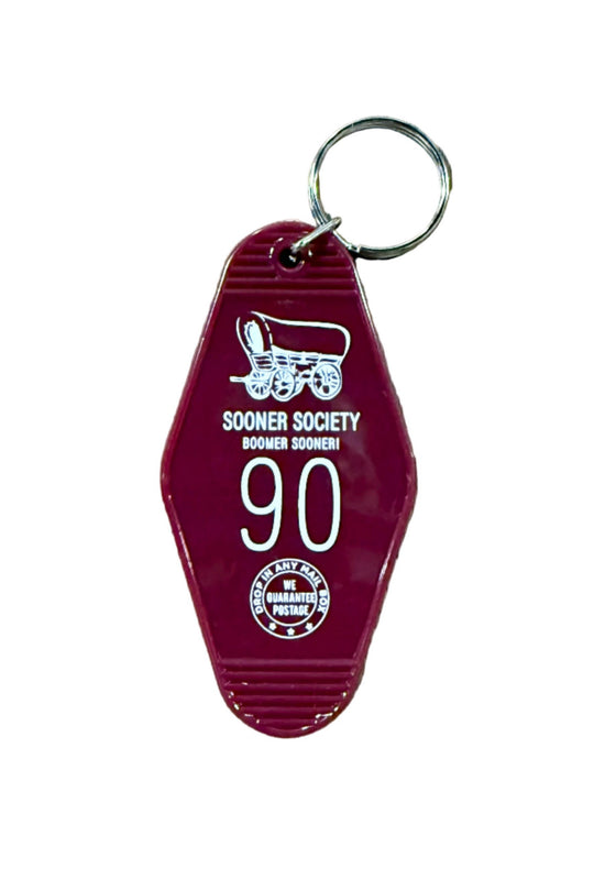 Red Sooner Society keychain with covered wagon design