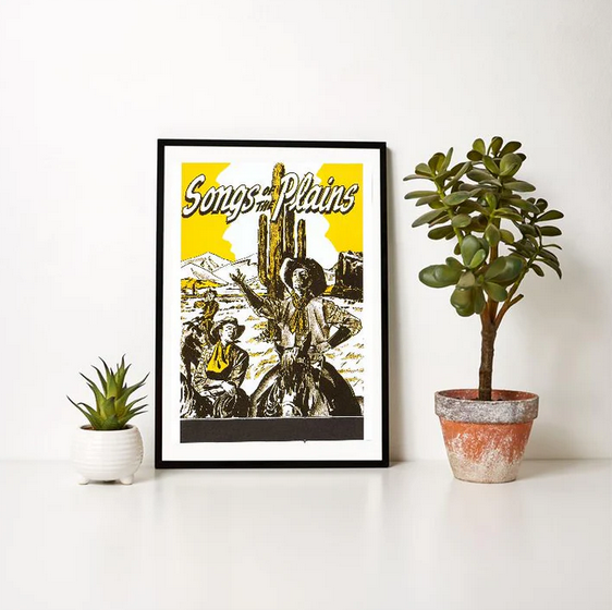 Songs of the Plains Western art print with cowboys, cacti, and desert scene, rustic Americana decor.