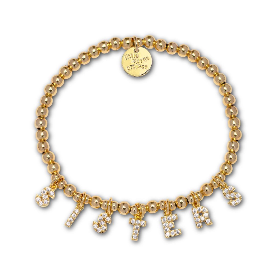 Gold beaded bracelet with gold and rhinestone letter-shaped charms spelling out "SISTERS".