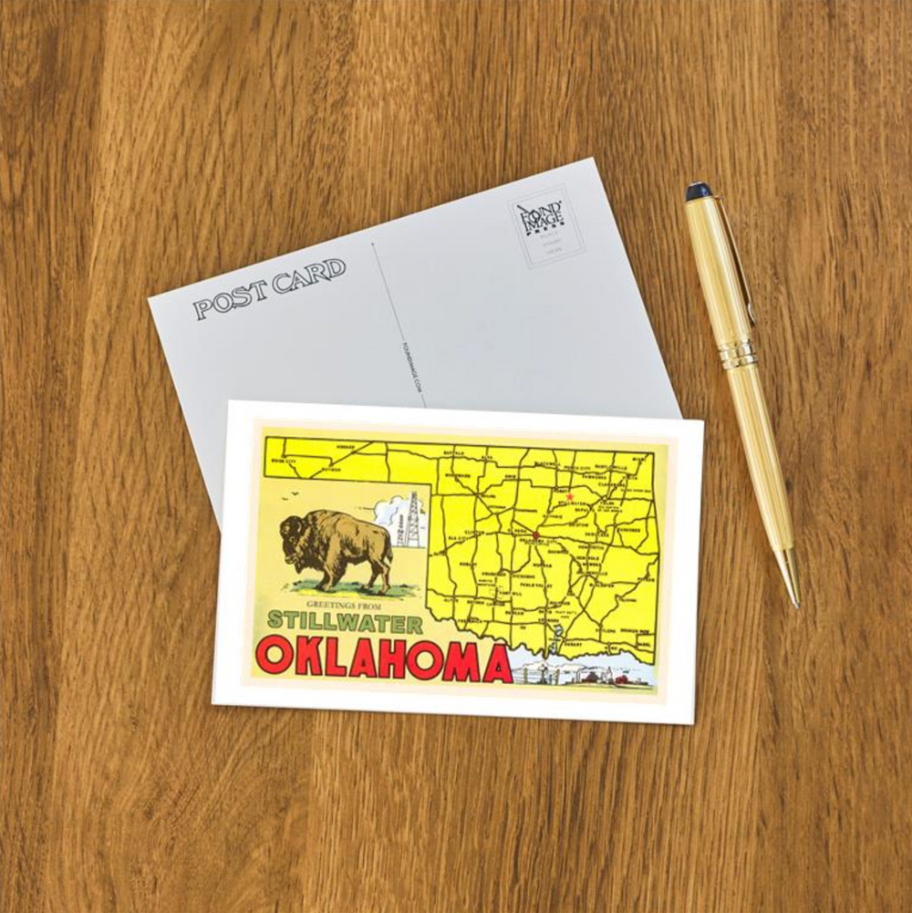 Retro postcard featuring a colorful Oklahoma map and buffalo with mid-century “Greetings from Stillwater” lettering.