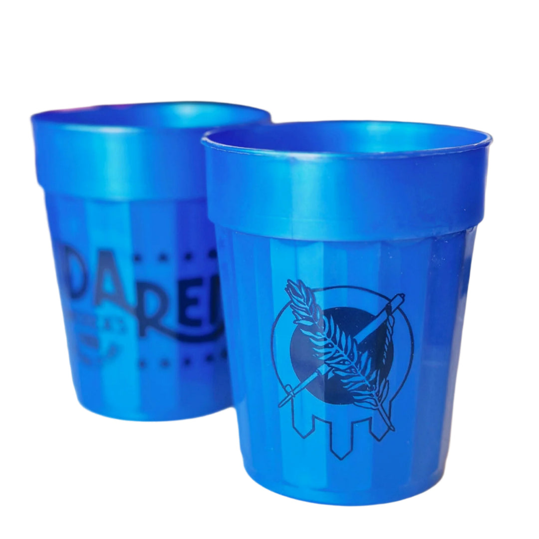 Blue stacking cup featuring Ida Red store logo on one side and Osage shield on the other