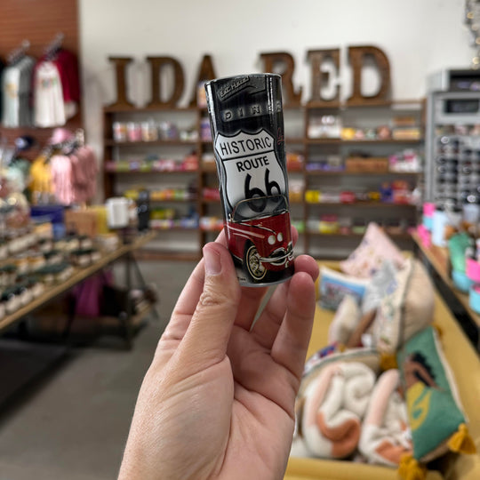 Collectible Americana shooter glass with Route 66 design, red car, and retro roadside symbols – perfect barware gift