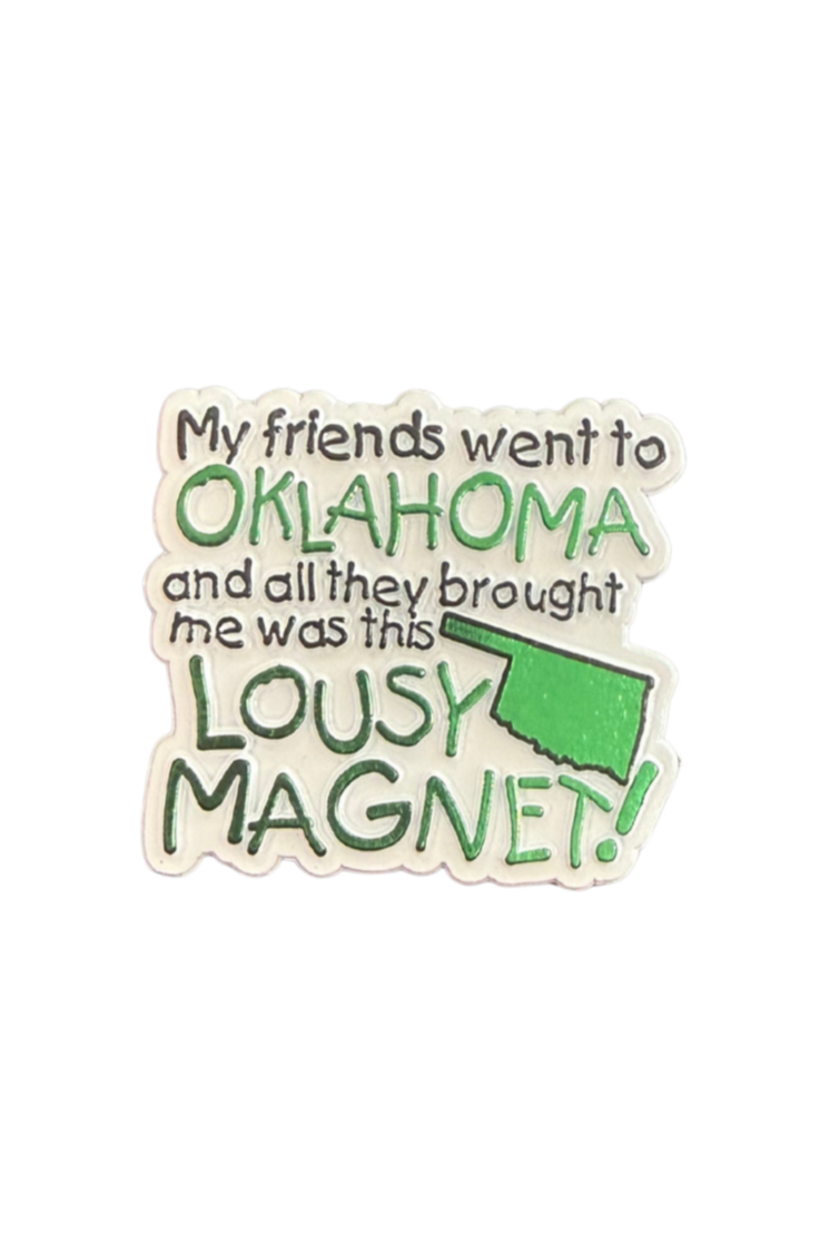 White magnet with green Oklahoma state outline and text “My friends went to Oklahoma and all they brought me was this lousy magnet”