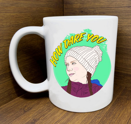 Ceramic mug with hand-drawn image of Greta Thunberg and the phrase “How Dare You”
