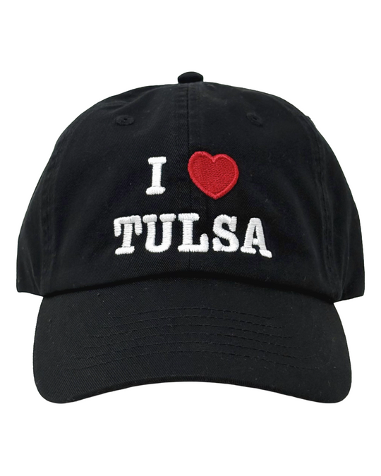 A black baseball cap, with the words "I ❤️ TULSA" embroidered on the front, against a white background.