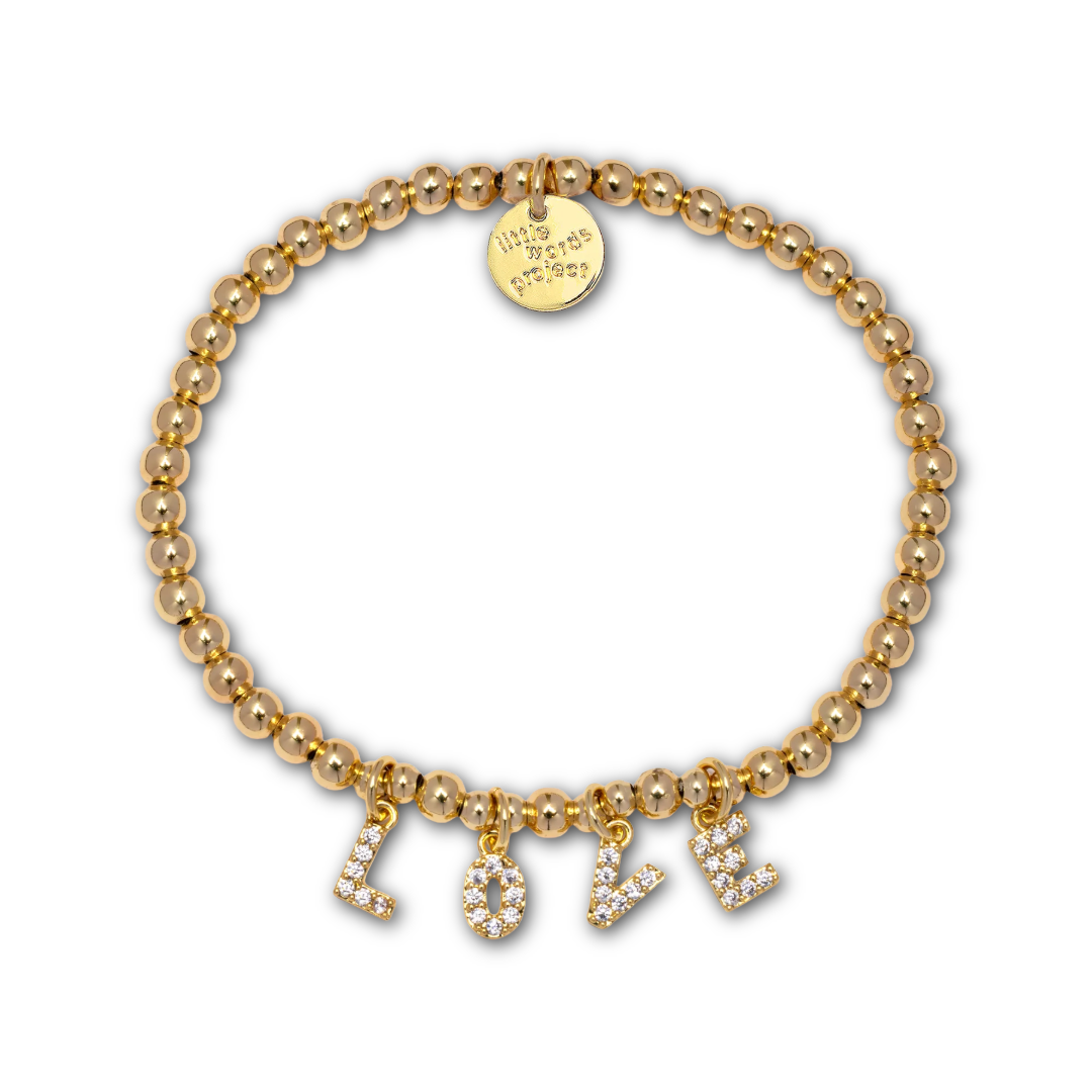 Gold beaded bracelet with gold and rhinestone letter-shaped charms spelling out "LOVE".