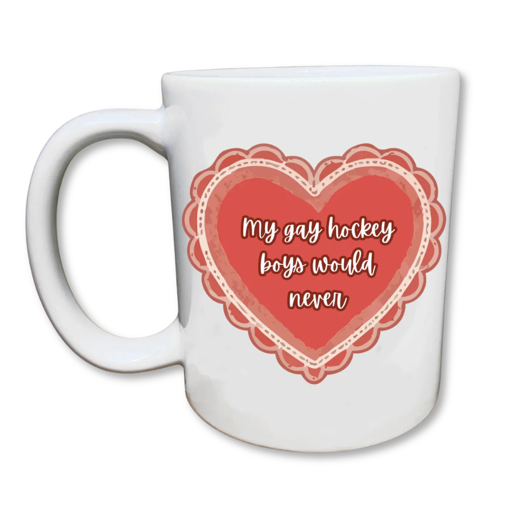 White mug with a red heart design and the phrase “my gay hockey boys would never” in a playful script font.