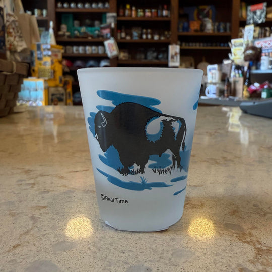 Frosted shot glass with Oklahoma design – black and blue buffalo and teepees on opposite sides