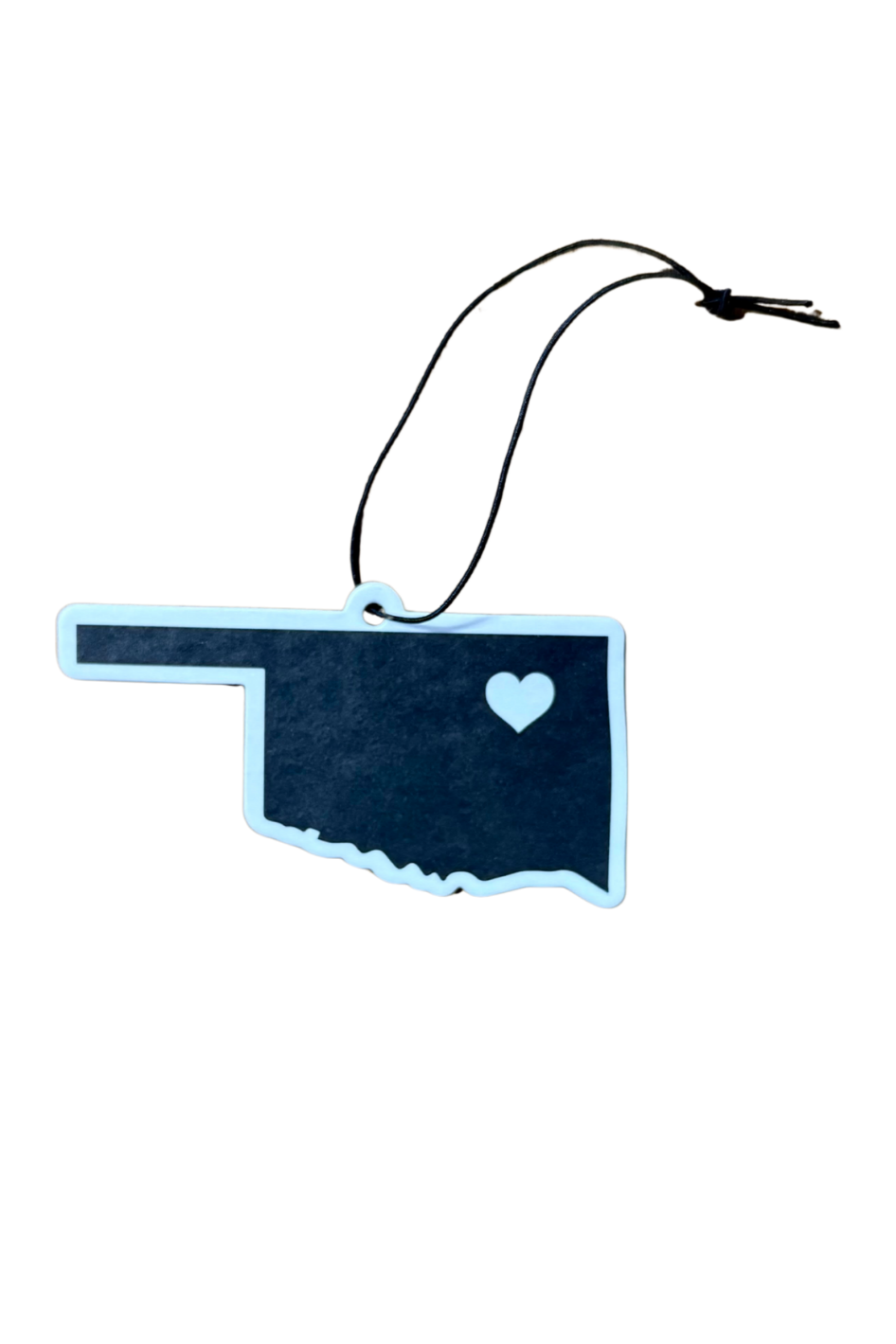 Black Oklahoma-shaped car air freshener with white heart marking Tulsa – new car scent souvenir