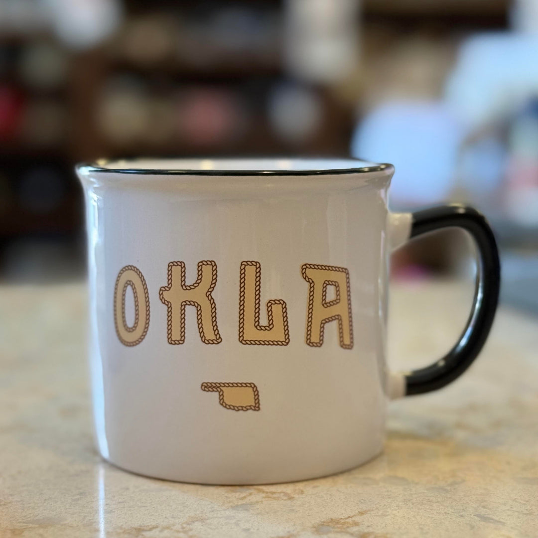 Oklahoma souvenir mug with state outline and rope design