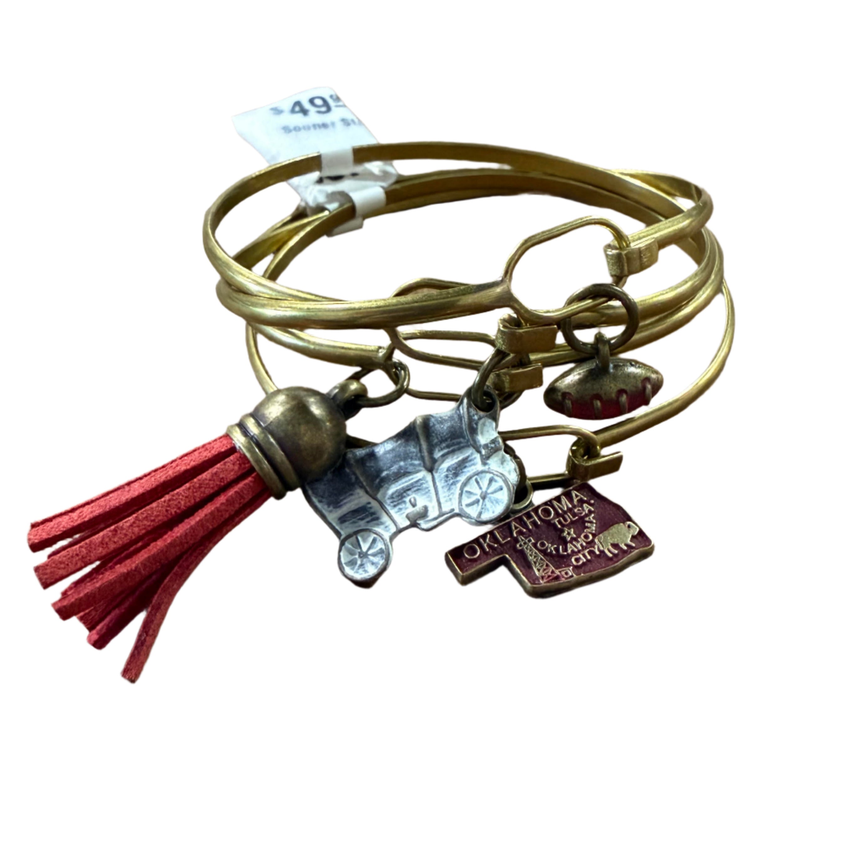 OU Sooners bracelet stack with gold-tone bangles featuring football, red Oklahoma charm, covered wagon, and tassel