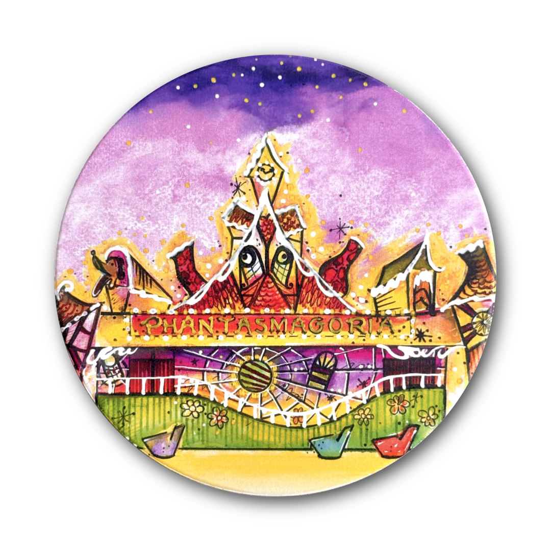 A round printed coaster featuring a colorful watercolor illustration of a whimsical fairground scene with the text 'PHANTASMAGORIA' across the center, shown on a plain white background.