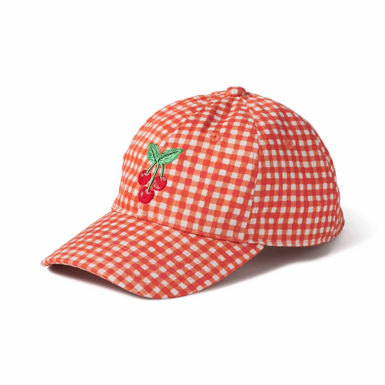 A red and white gingham baseball cap featuring an embroidered cherry design on the front, set against a plain white background.