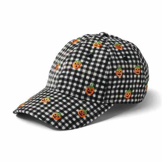 A baseball cap featuring a black and white gingham check pattern with small orange jack-o'-lantern motifs, shown on a clean white background.