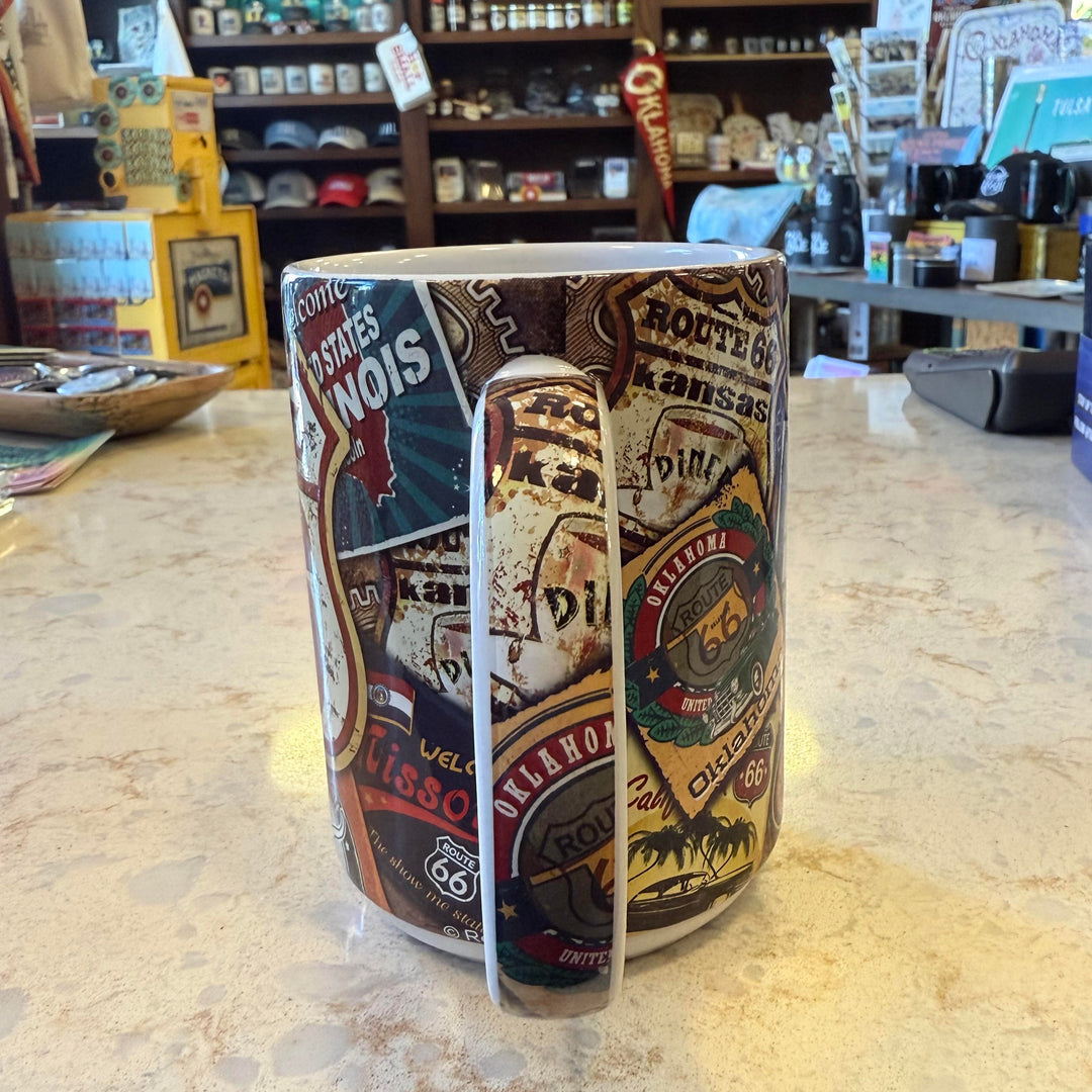 Handle view of Route 66 shield mug with retro collage of iconic posters from the historic highway