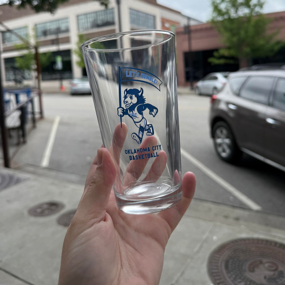 Pint glass with Rumble the Bison holding a flag – perfect OKC Thunder gift