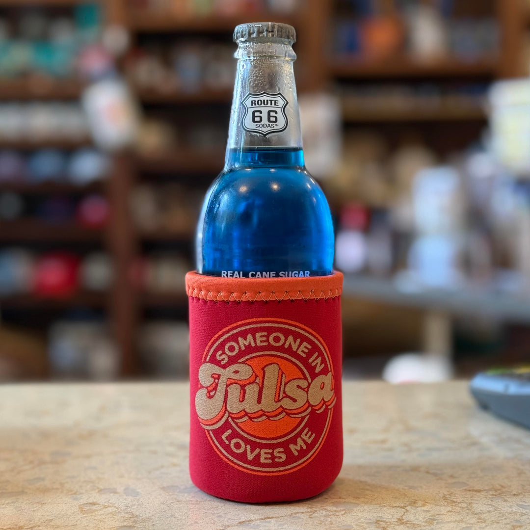 Red drink koozie with orange accents that says "Someone in Tulsa Loves Me" – Oklahoma souvenir gift