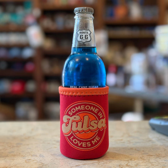 Red drink koozie with orange accents that says "Someone in Tulsa Loves Me" – Oklahoma souvenir gift