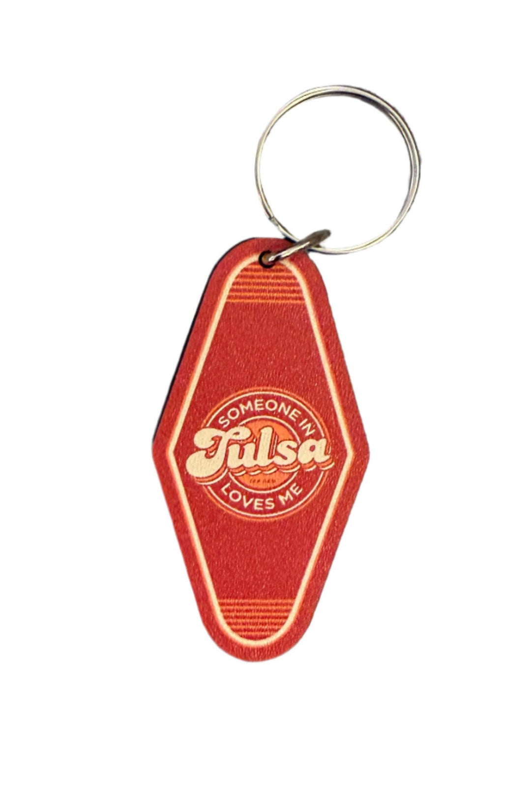 Retro motel-style keychain with the phrase “Someone in Tulsa Loves Me” in bold lettering