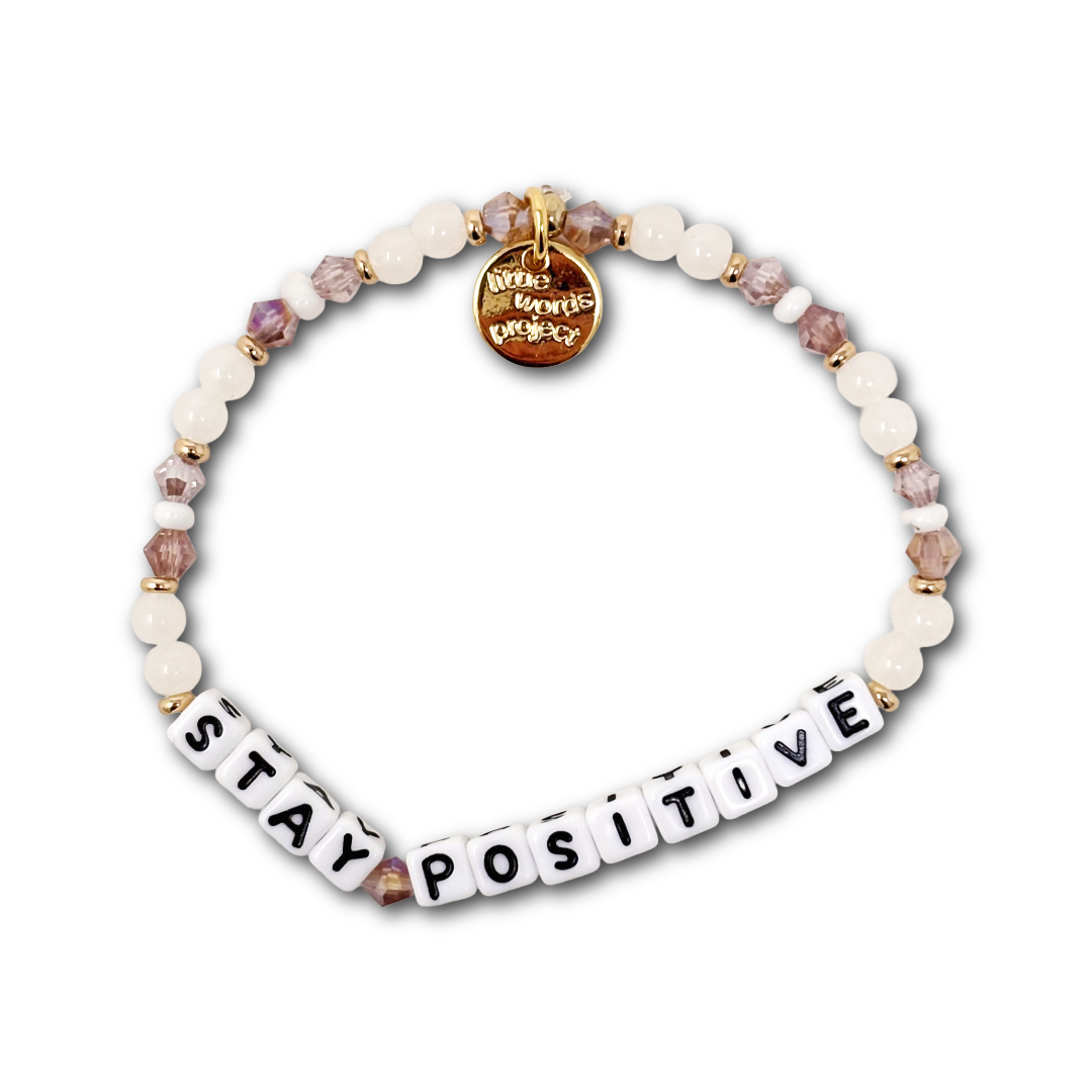 Bracelet with pink and white beads and letter beads spelling out "STAY POSITIVE".