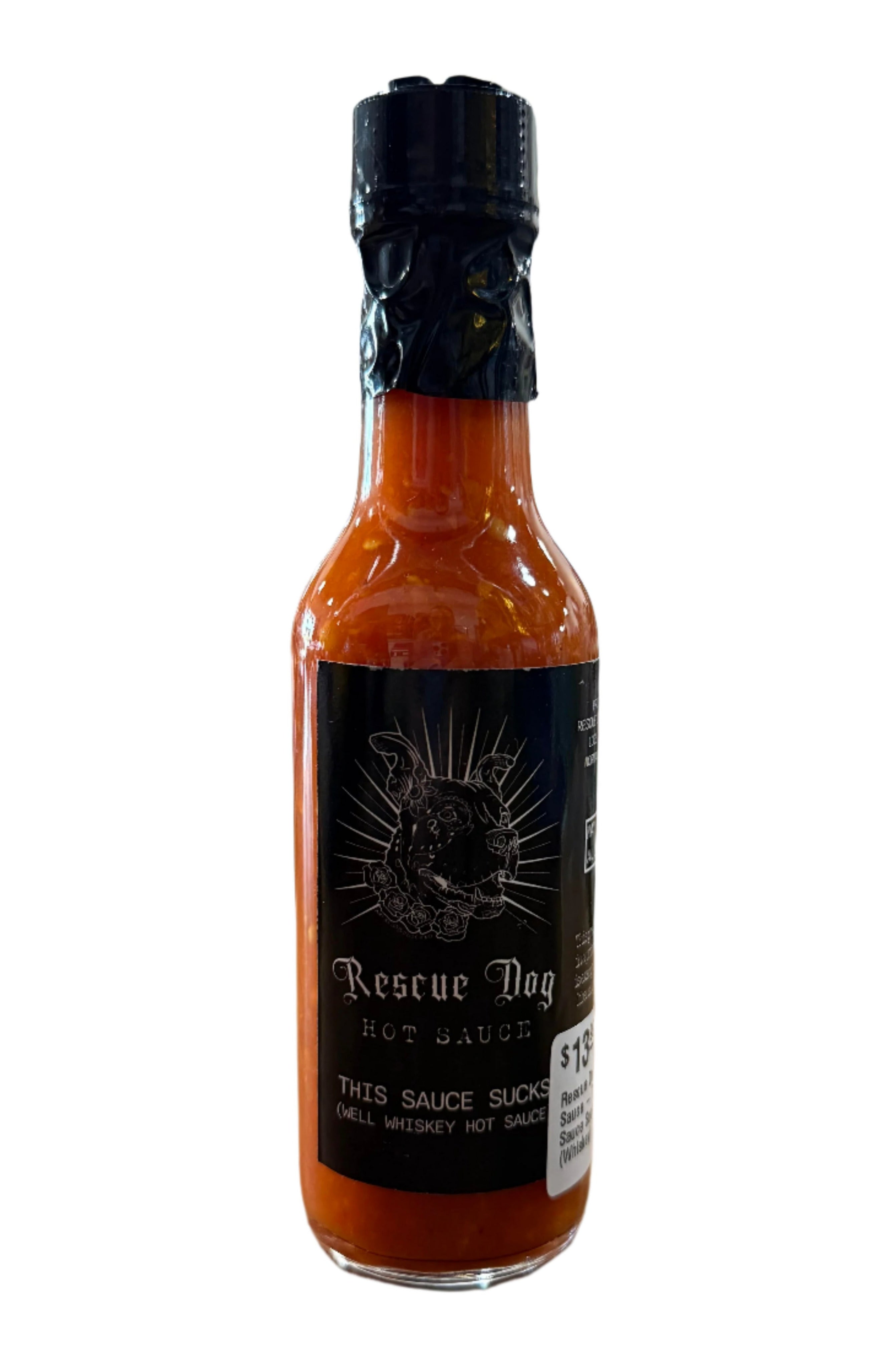 Bottle of “This Sauce Sucks” by Rescue Dog Hot Sauce, a small batch Oklahoma-made hot sauce